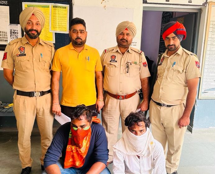 Two arrested for snatching cash from migrant